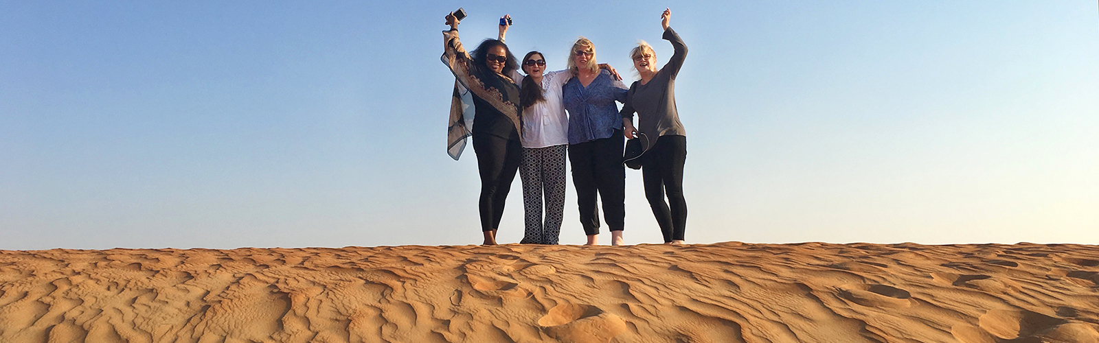 Women Traveling Together on the Dunes